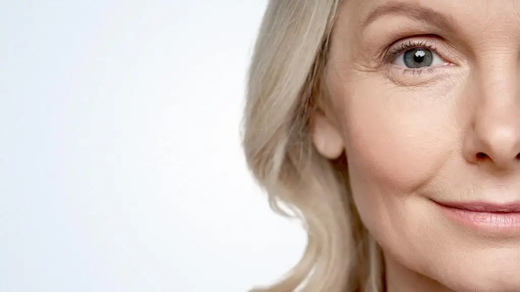 middle aged woman looking at camera isolated on white background dry skin care treatment anti age skincare beauty, plastic surgery, cosmetology procedures. Close up half face view