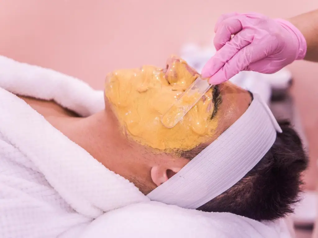 man getting a facial treatment